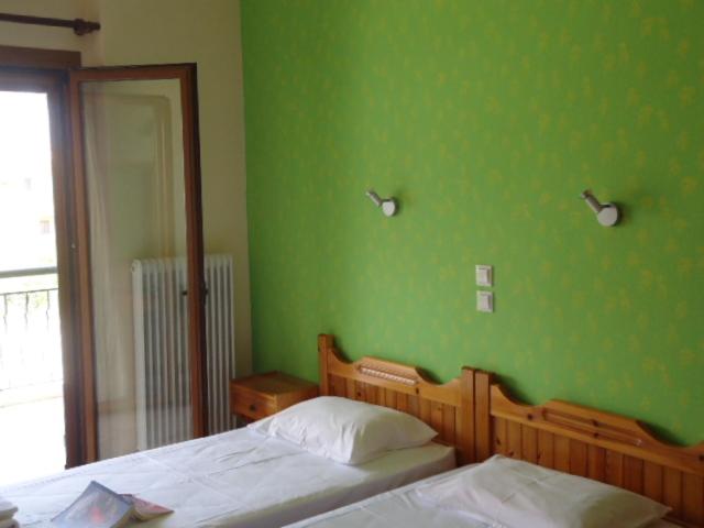 Tempat tidur dalam kamar di Almini2 Apartments