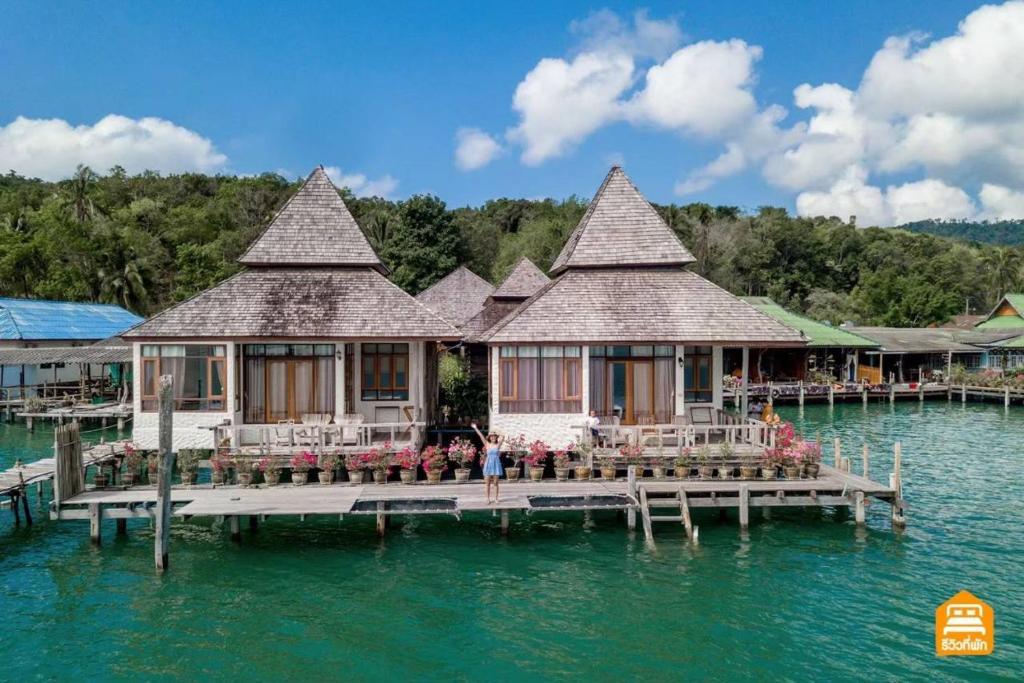 a house on a dock in the water at Salakphet Resort in Ko Chang