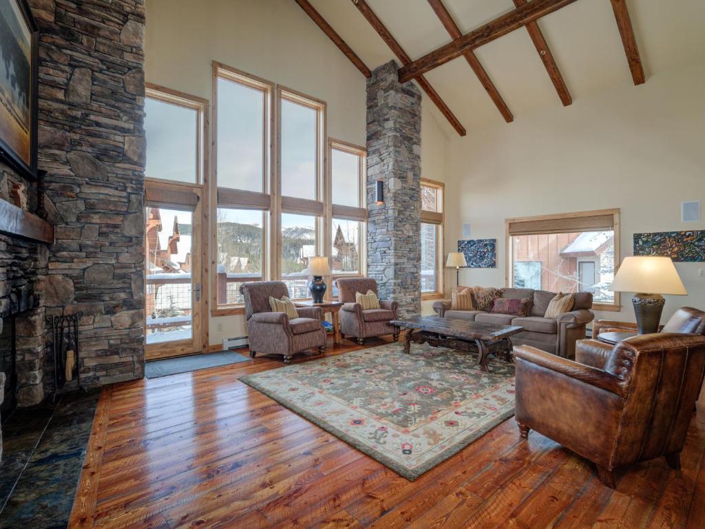 a living room with a couch and a fireplace at Black Eagle 31 in Big Sky