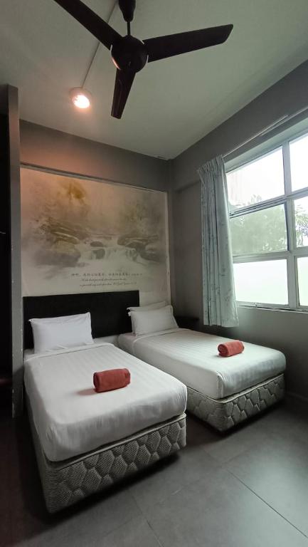 Postel nebo postele na pokoji v ubytování Jabez Resort Kundasang