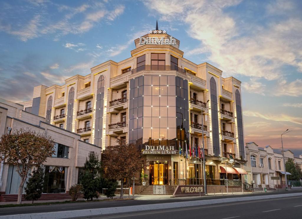 a building on a street in front of a building at DiliMah Premium Luxury in Samarkand