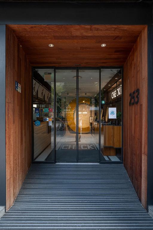 an entrance to a building with glass doors at CHECK inn Taipei Songjiang in Taipei