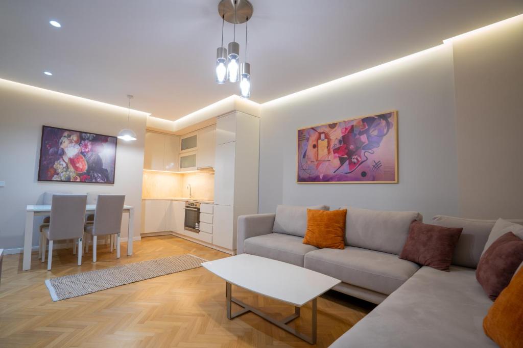a living room with a couch and a table at Center Tirana Liv apartment in Tirana