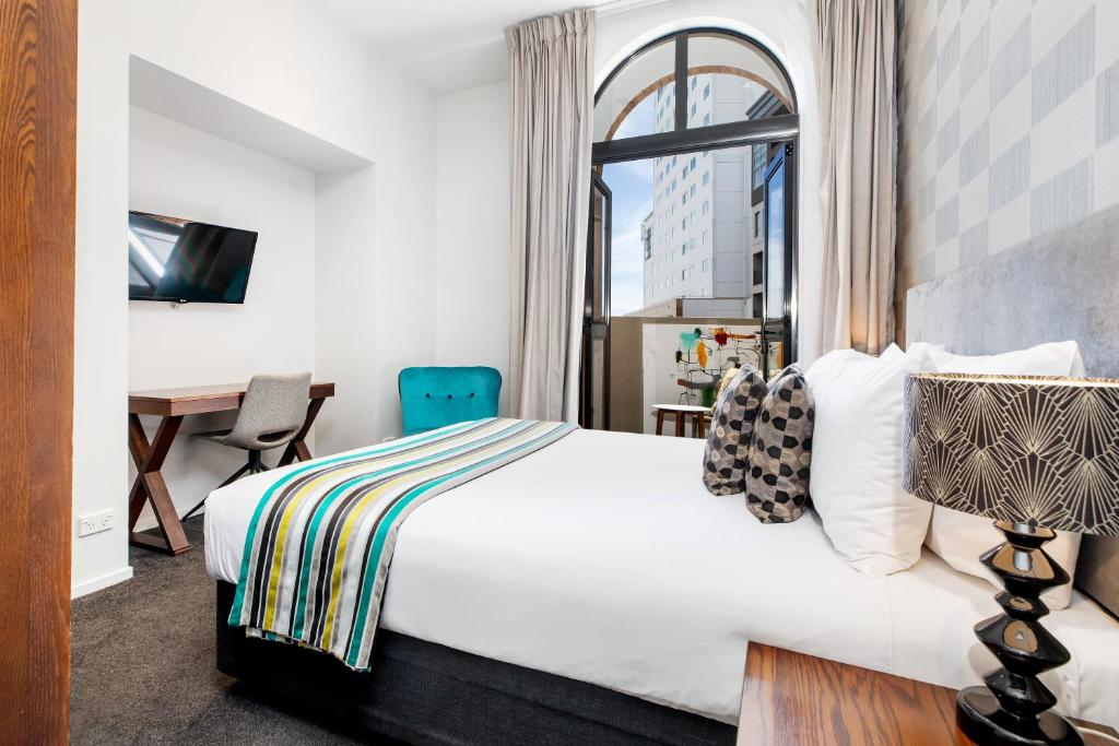 Postel nebo postele na pokoji v ubytování Hotel 115