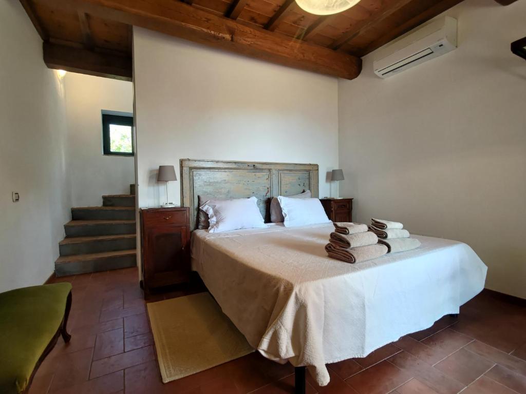 Postel nebo postele na pokoji v ubytování Agriturismo La Fontaccia