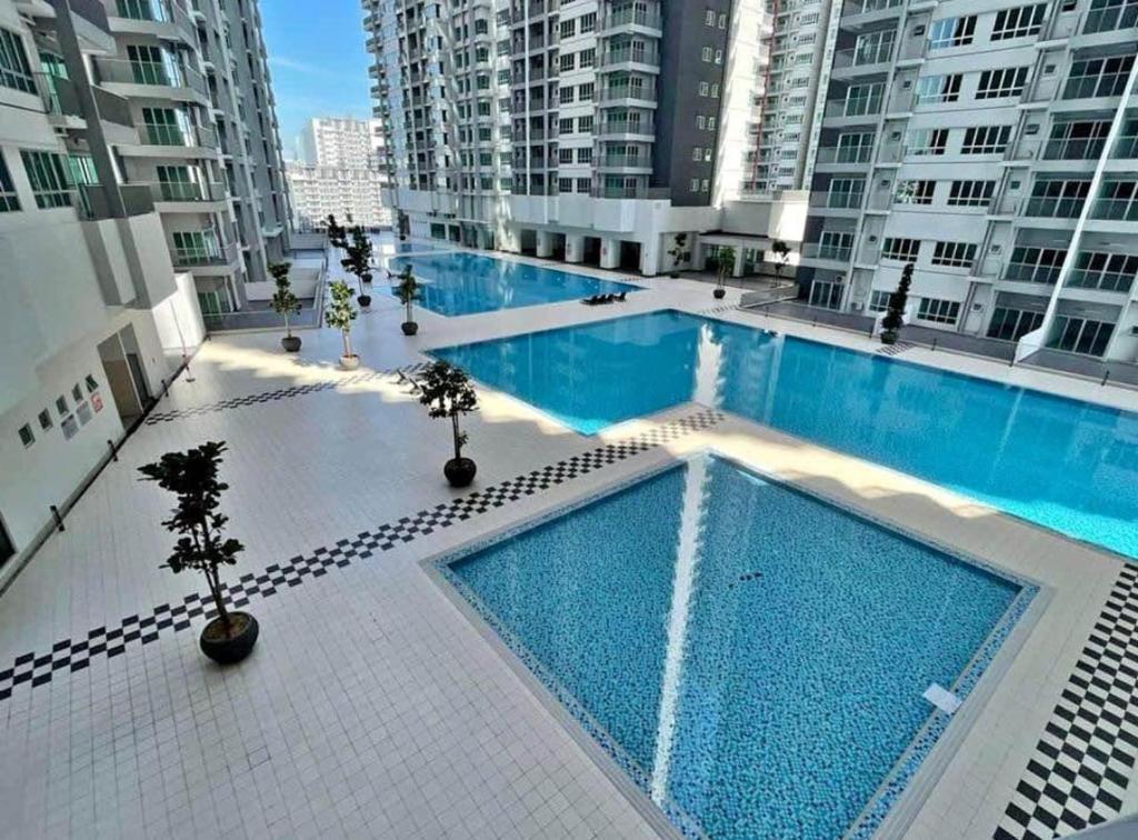 an overhead view of a swimming pool in a building at RC Firdaus Homestay Kuala Lumpur in Kuala Lumpur