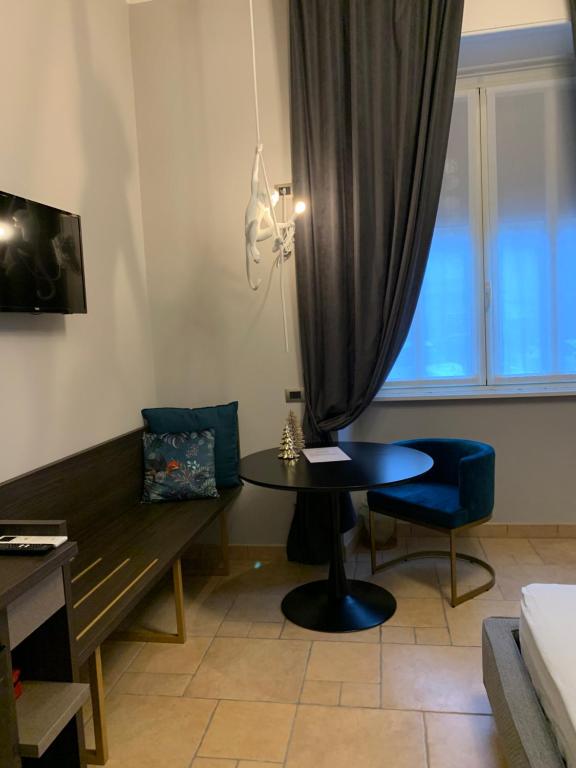a room with a desk and a table and a window at Spazio SIMA Space 2 - 2 in Milan