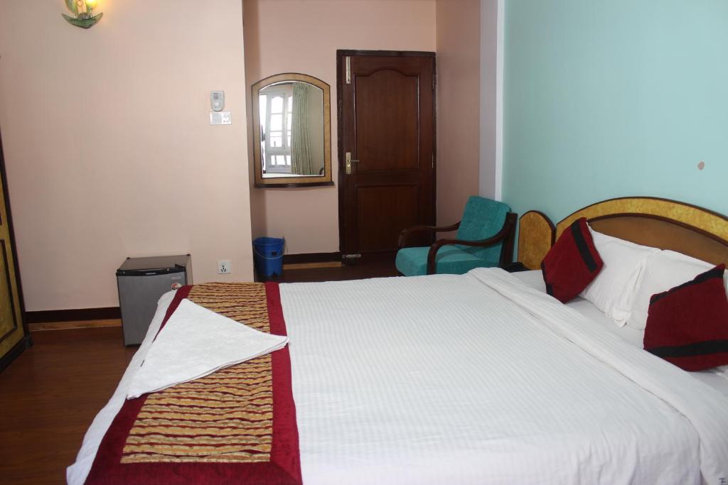Postel nebo postele na pokoji v ubytování Hotel Mudkhu Durbar
