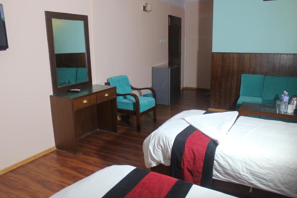 Postel nebo postele na pokoji v ubytování Hotel Mudkhu Durbar