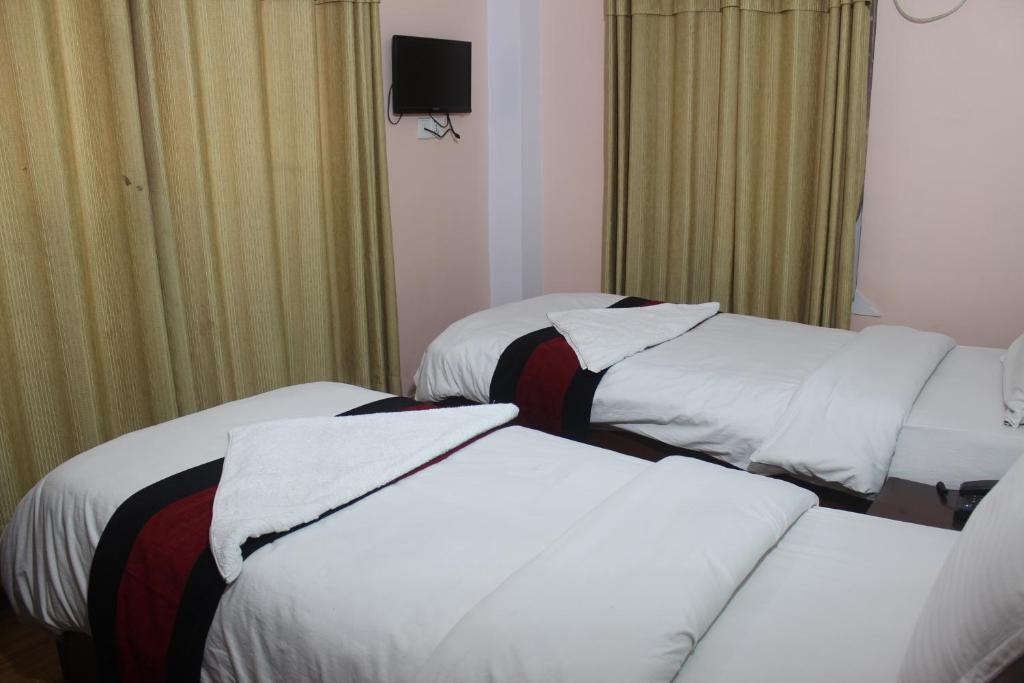 Postel nebo postele na pokoji v ubytování Hotel Mudkhu Durbar