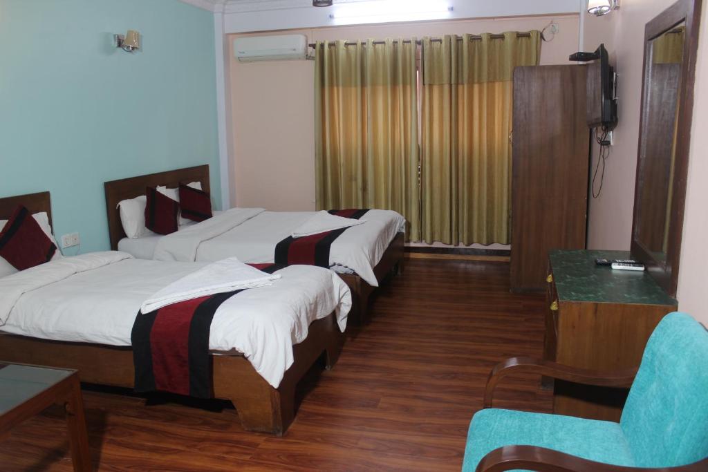 Postel nebo postele na pokoji v ubytování Hotel Mudkhu Durbar