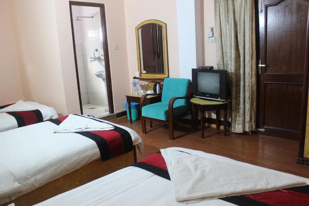 Postel nebo postele na pokoji v ubytování Hotel Mudkhu Durbar