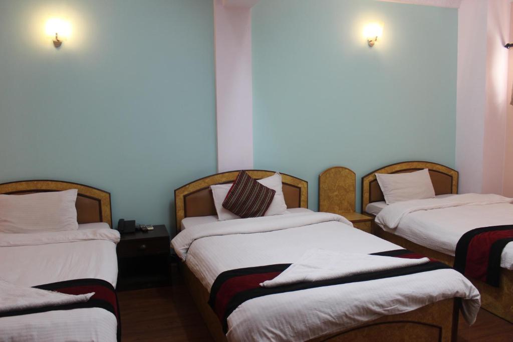 Postel nebo postele na pokoji v ubytování Hotel Mudkhu Durbar