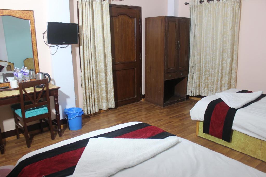 Postel nebo postele na pokoji v ubytování Hotel Mudkhu Durbar