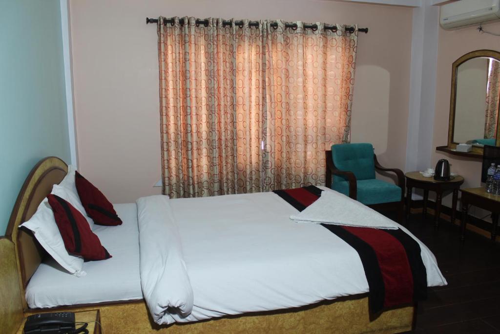 Postel nebo postele na pokoji v ubytování Hotel Mudkhu Durbar