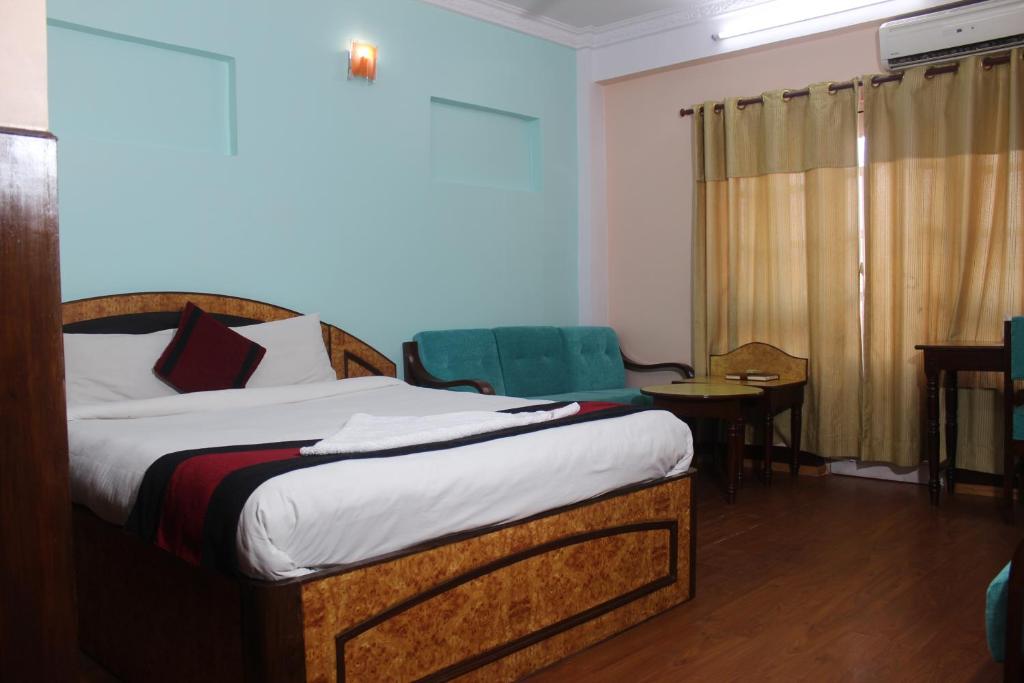 Postel nebo postele na pokoji v ubytování Hotel Mudkhu Durbar