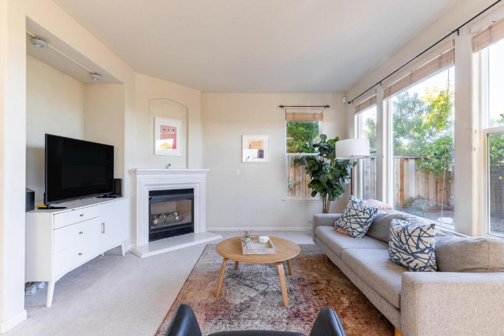 a living room with a couch and a fireplace at Newark 4br w backyard patio ac garage SFO-1586 in Newark