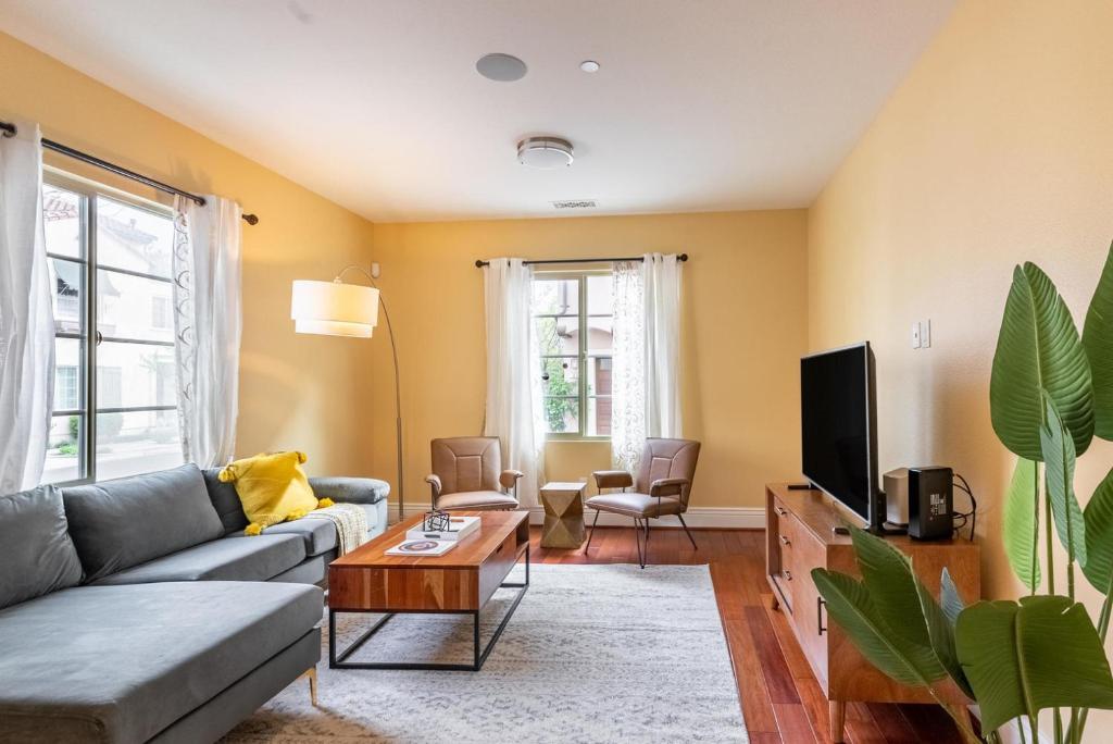 a living room with a couch and a tv at Milpitas 4br w garage nr mall dining SFO-1593 in Milpitas