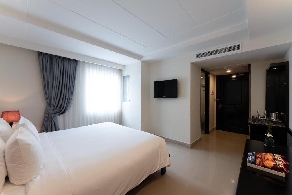 เตียงในห้องที่ Saigon E Central Hotel