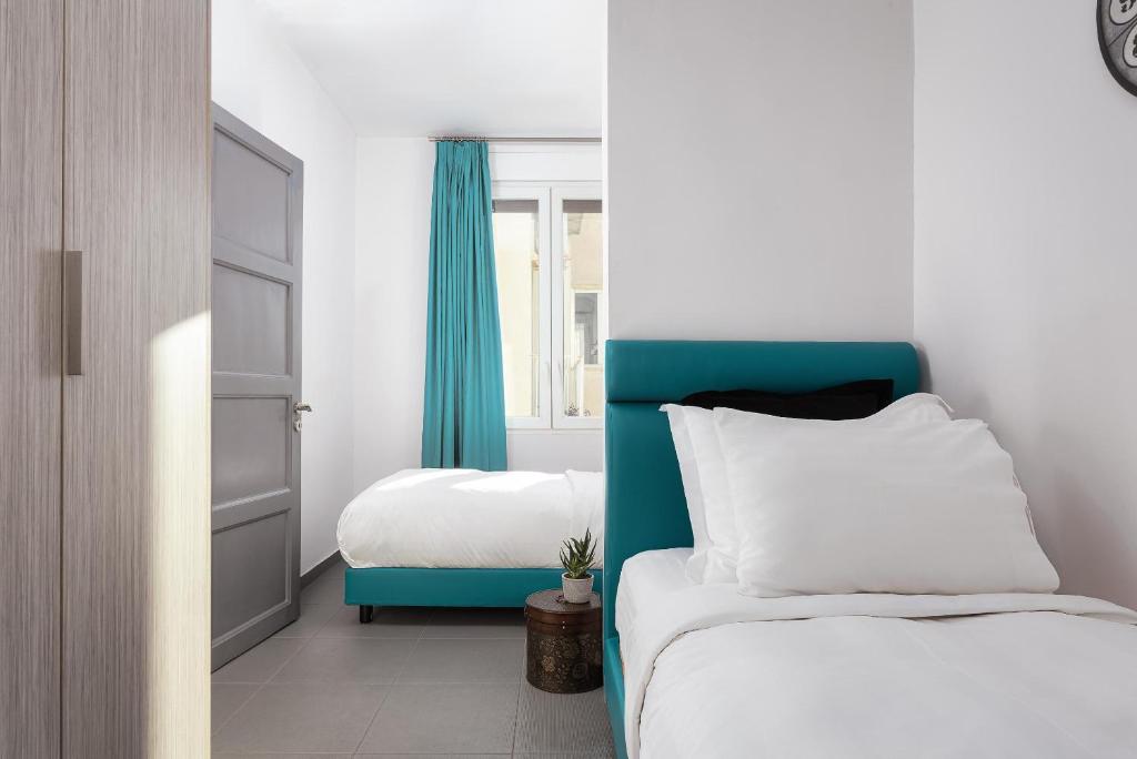 Posteľ alebo postele v izbe v ubytovaní Acropolis Elegant Penthouse