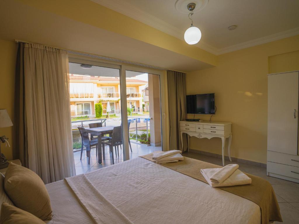 Postel nebo postele na pokoji v ubytování Sunset Beach Villas and Apartments