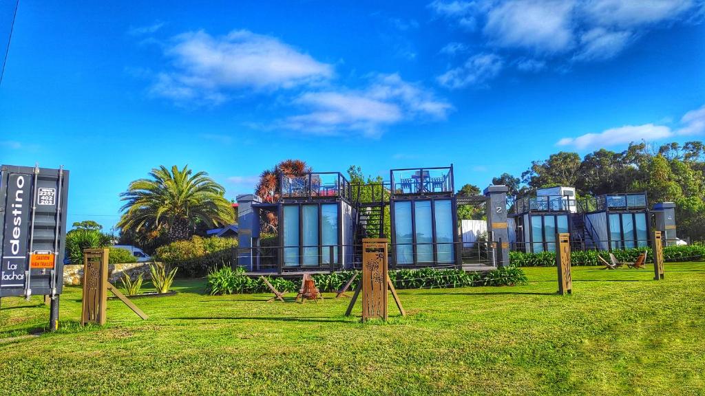 a building with a playground in a park at Destino Los Tachos in Mar del Plata