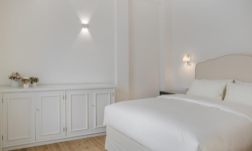 Posteľ alebo postele v izbe v ubytovaní Etoile Luxury Suites