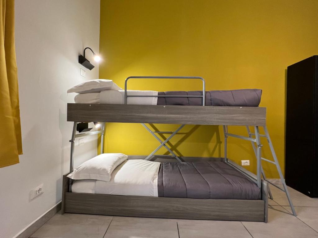 Postel nebo postele na pokoji v ubytování Palladini Rome