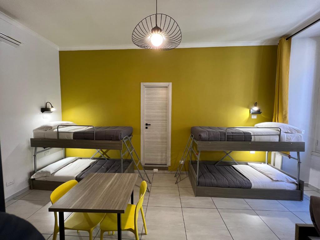 Postel nebo postele na pokoji v ubytování Palladini Rome