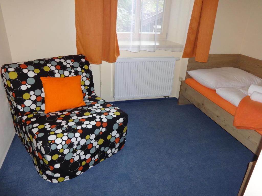 Postel nebo postele na pokoji v ubytování Hotel Praha Potštejn