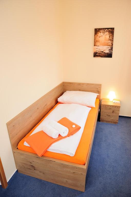 Postel nebo postele na pokoji v ubytování Hotel Praha Potštejn