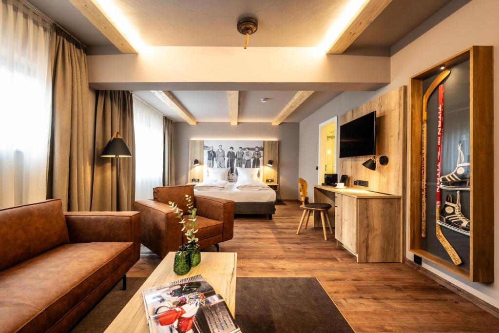 TV a/nebo společenská místnost v ubytování Hotel HerzogsPark