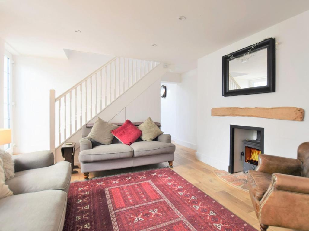 a living room with a couch and a fireplace at 3 Bed in Folkestone 75607 in Sandgate