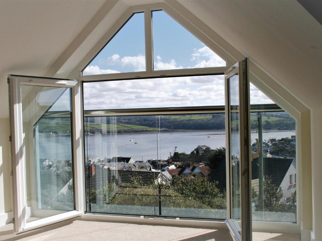 a large window in a house with a view of a river at 4 bed in Appledore 76483 in Appledore