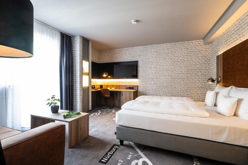 Postel nebo postele na pokoji v ubytování Hotel HerzogsPark