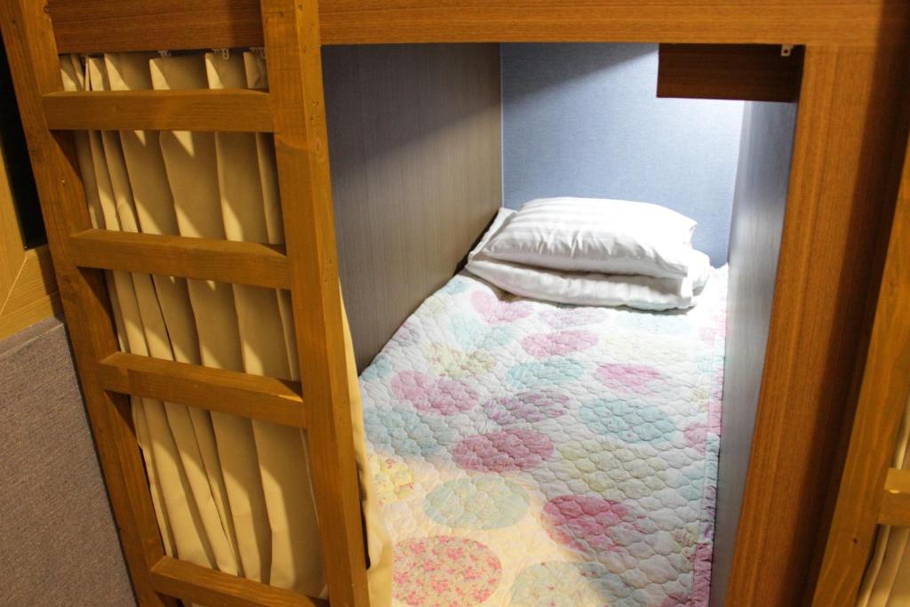 Postel nebo postele na pokoji v ubytování Bexco Hostel B&B