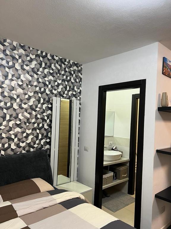 Postel nebo postele na pokoji v ubytování Apartment Tazzoli 11