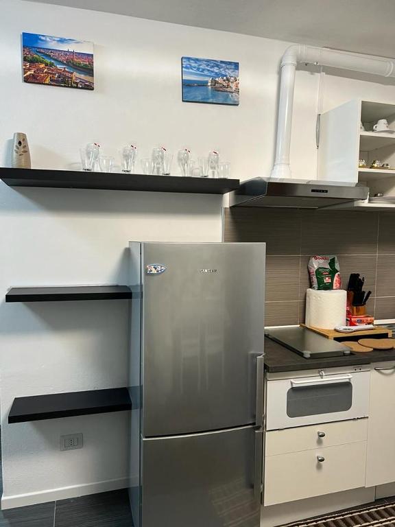 Kuchyň nebo kuchyňský kout v ubytování Apartment Tazzoli 11