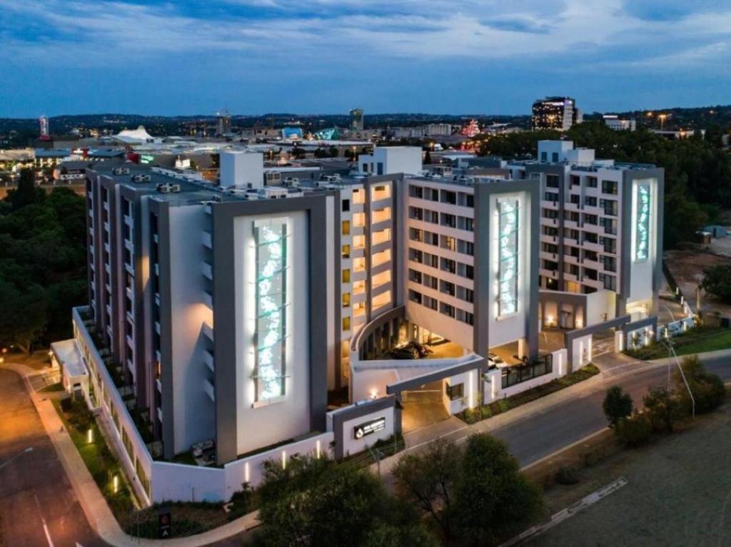 an overhead view of a large building at night at The Regency Aparthotel in Pretoria