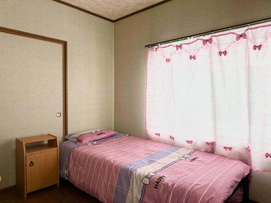 Postel nebo postele na pokoji v ubytování PENSION YunShuiYao雲水瑶民宿