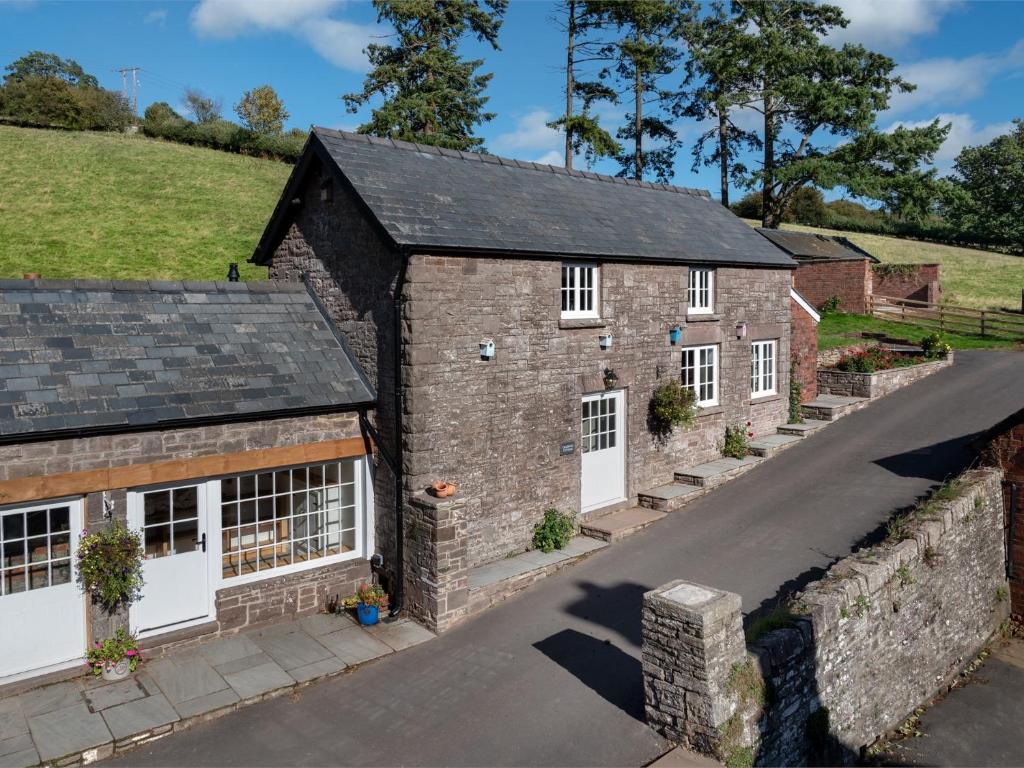 an aerial view of a brick house with a driveway at 1 Bed in Bwlch BN270 in Llansantffread