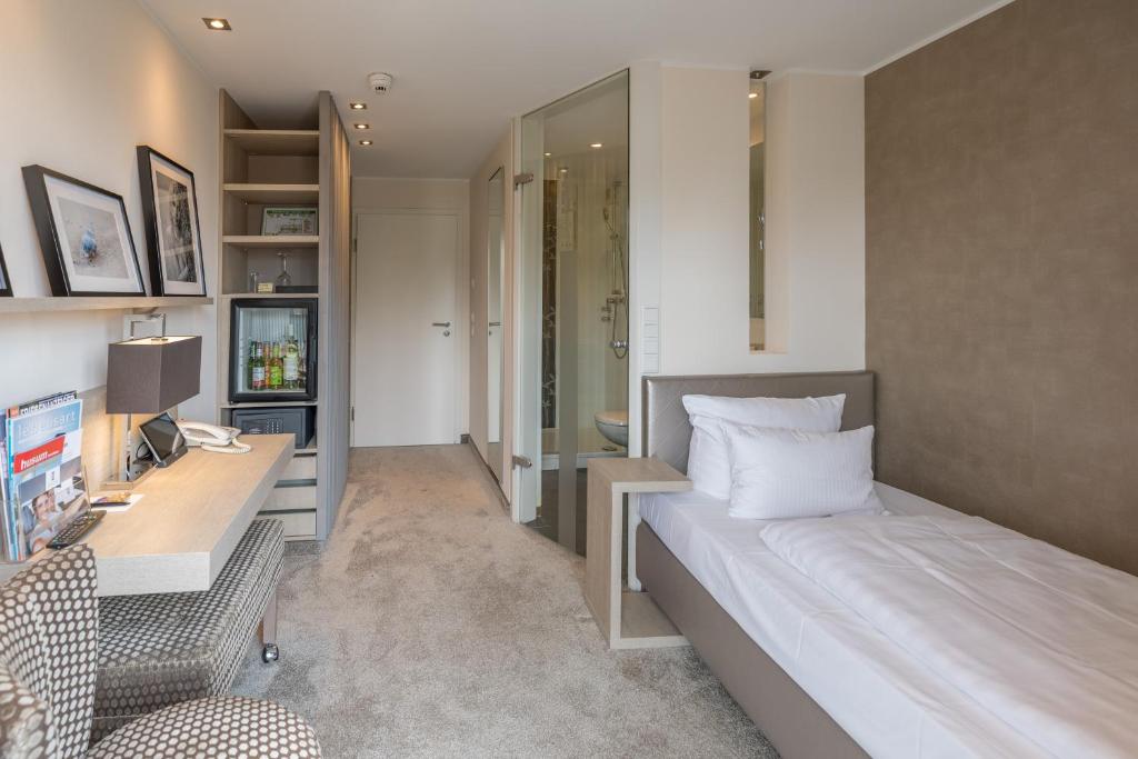 Postel nebo postele na pokoji v ubytování Thomas Hotel Spa & Lifestyle