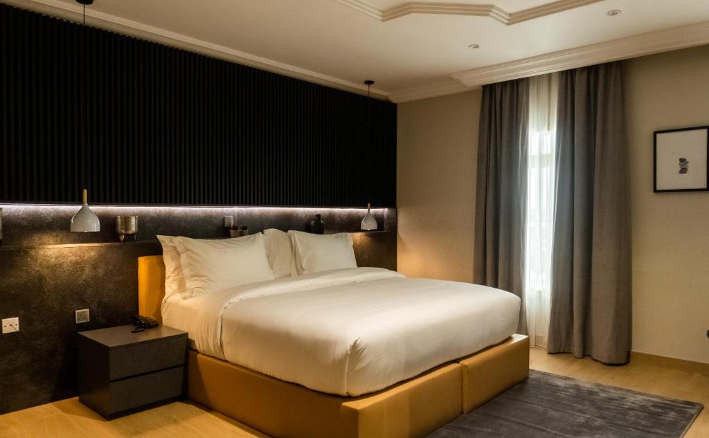 En eller flere senge i et værelse på Hiro Hotel 05