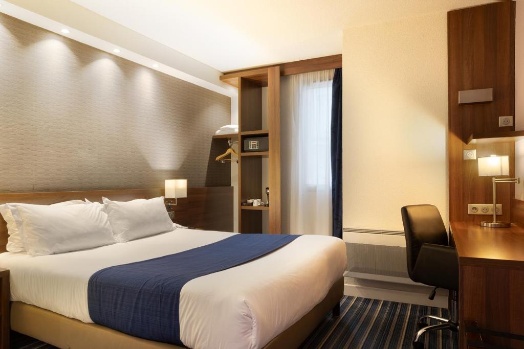 a hotel room with a bed and a desk and a desk at Holiday Inn Express Amiens, an IHG Hotel in Amiens