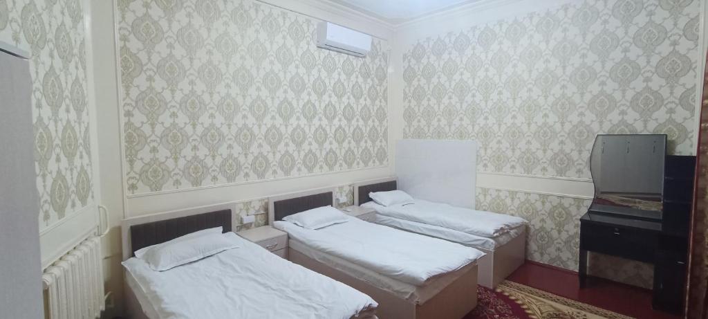 Postel nebo postele na pokoji v ubytování Bruce hostel
