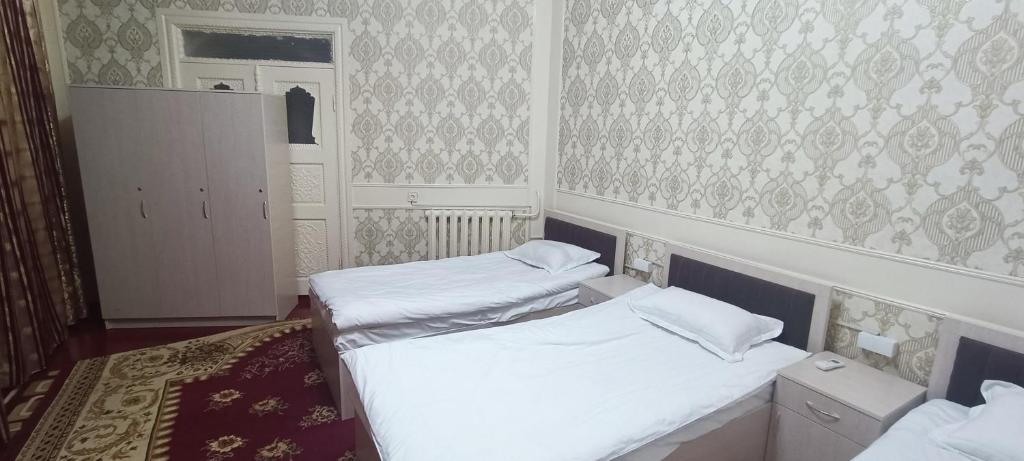 Postel nebo postele na pokoji v ubytování Bruce hostel
