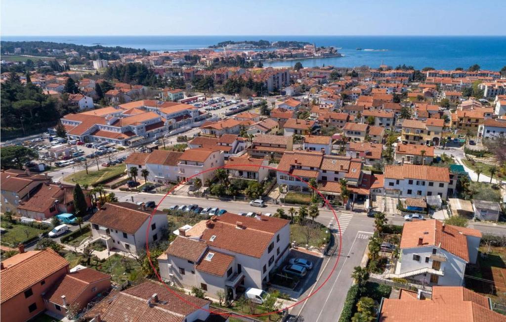 an aerial view of a town with houses and the ocean at Sunset Porec 2 in Poreč