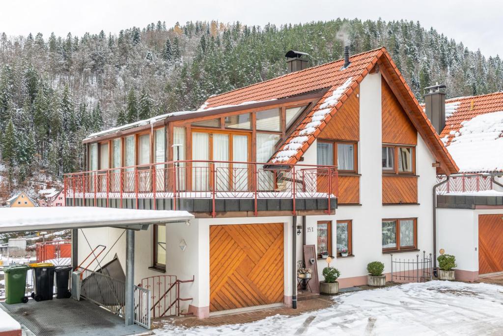 a large house with a balcony on top of it at Schwarzwald Nescht Triberg in Triberg