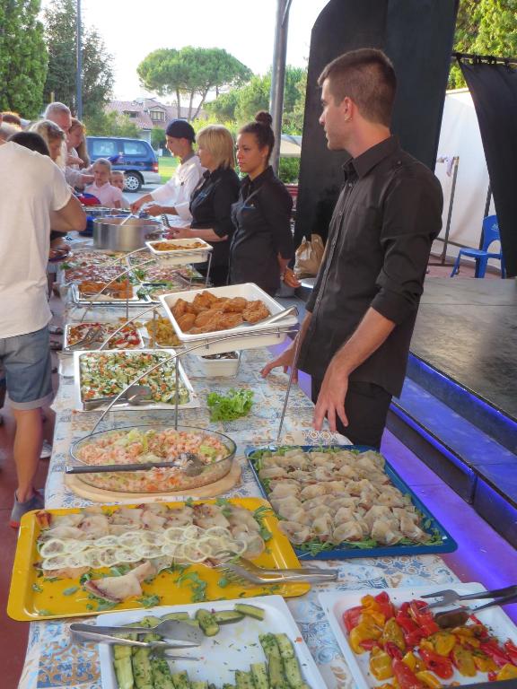 a buffet line with many different types of food at Hotel Maxim in Caorle
