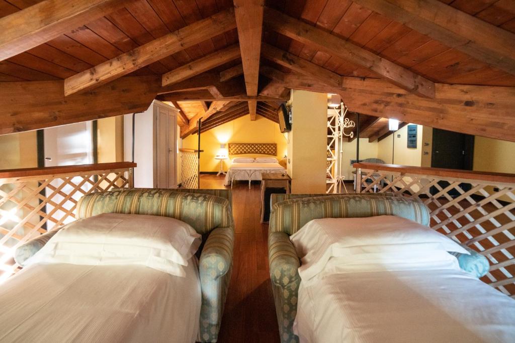 Postel nebo postele na pokoji v ubytování Hotel Residence Montelago